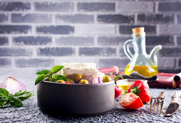Greek salad with tomatoes, feta cheese, cucumbers, onions and olives