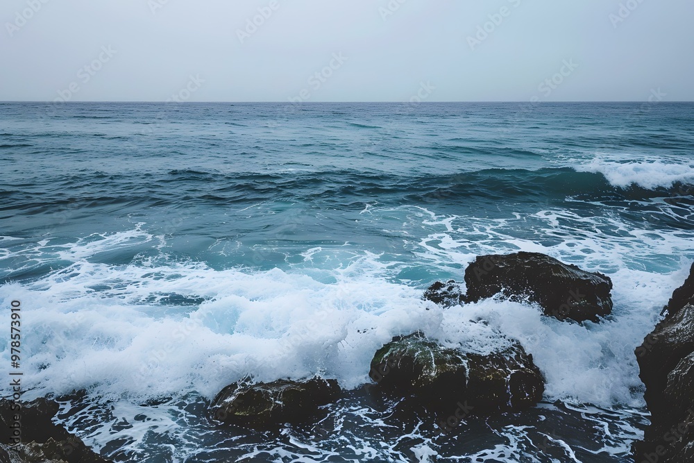 Sticker Ocean Waves Crashing on Rocky Shore