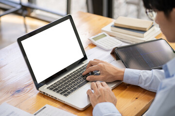 Business man working by using laptop computer Hands typing on a keyboard. Professional investor working new start up project. business planning in office. Technology business Concept.