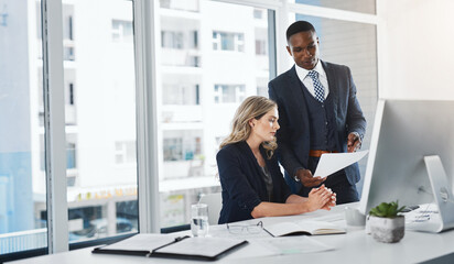 Office, documents and business people on computer for online research, website and planning. Corporate lawyers, professional and man and woman with paperwork for advice, discussion and collaboration