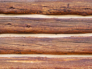 Detail of the rustic siding of a log cabin in Idaho, USA