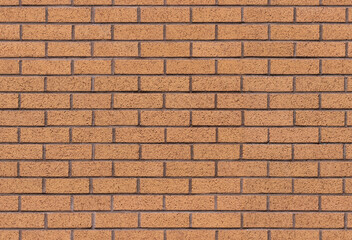 Brown brick wall seamless background texture image. Traditional block masonry surface. A modern interior and exterior and backdrop tile design. Built in traditional bond brickwork pattern