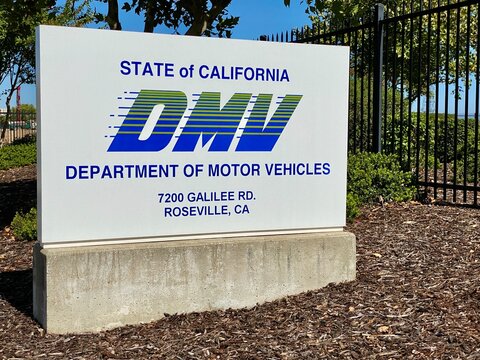 DMV is the Department of Motor Vehicles, street sign at Roseville, CA.