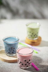Different Healthy vegan drink Matcha  Latte  with Boba or Tapioca pearls in glasses. Bubble tea concept