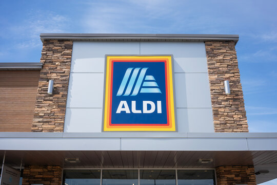 Delano, CA, USA - Mar 26, 2022: Aldi logo is seen at one of its grocery stores in Delano, California. Aldi is the common brand of two German family-owned multinational discount supermarket chains.