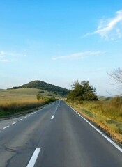 Scenic Road View: Open Fields, Trees, and Expansive Sky – Perfect for Travel and Nature Themes