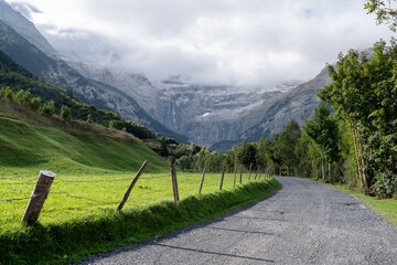 The Cirque of Gavarnie, french Pyrenes mountains. The mountains are covered in snow and the sky is cloudy