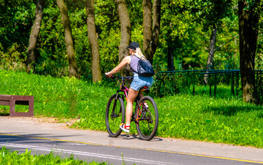 Fototapeta premium Cyclist ride on the bike path in the city Park 