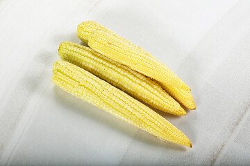 Raw sweet baby corn heap