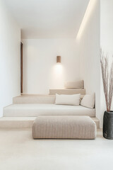 Elegant minimalist interior design featuring soft seating and subtle lighting in a serene, modern space