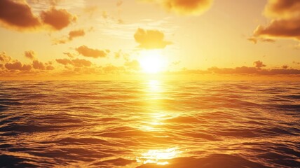 Fototapeta premium A stunning sunset over a calm ocean, with golden hues reflecting on the water, creating a serene and tranquil atmosphere.