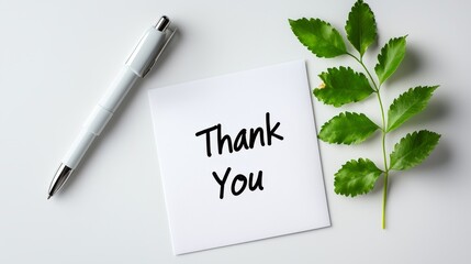 Minimalist handwritten "thank you" notes are placed on a white desktop, emphasizing the clarity of text and paper. A concise composition suitable for expressing gratitude and appreciation themes.