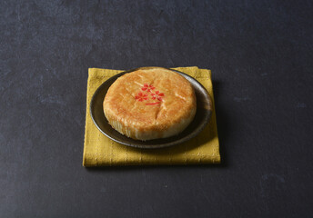 traditional baked teo chew chinese golden yellow mooncake lotus paste bean mooncake with 3d shape flower in black table lantern pastry autumn festival halal asian dessert food menu cafe