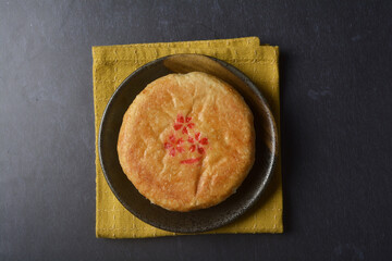 traditional baked teo chew chinese golden yellow mooncake lotus paste bean mooncake with 3d shape flower in black table lantern pastry autumn festival halal asian dessert food menu cafe