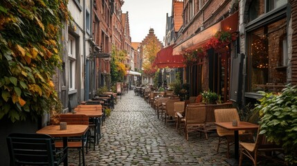 Fototapeta premium A quaint caf terrace in the old town of Leuven, Belgium, with cobblestone streets and outdoor seating.