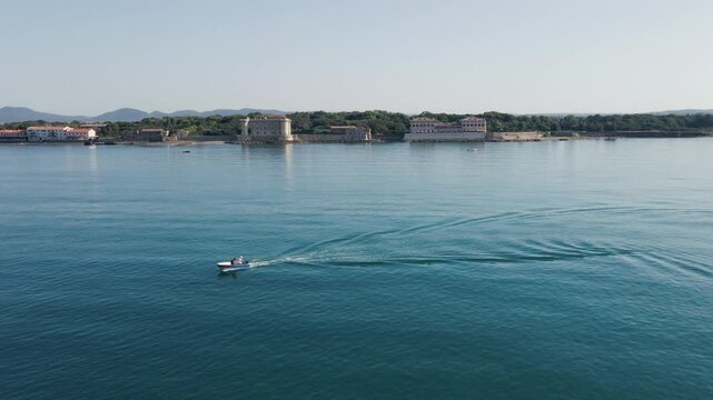 A boat travels along the waters off the Roman Coast in Ladispoli, Italy.