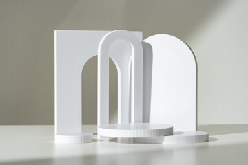 Modern Minimalist White Sculpture Displayed on Soft Draped Fabric in Natural Light
