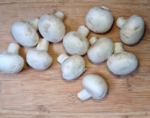 Bamboo cutting board with button mushrooms