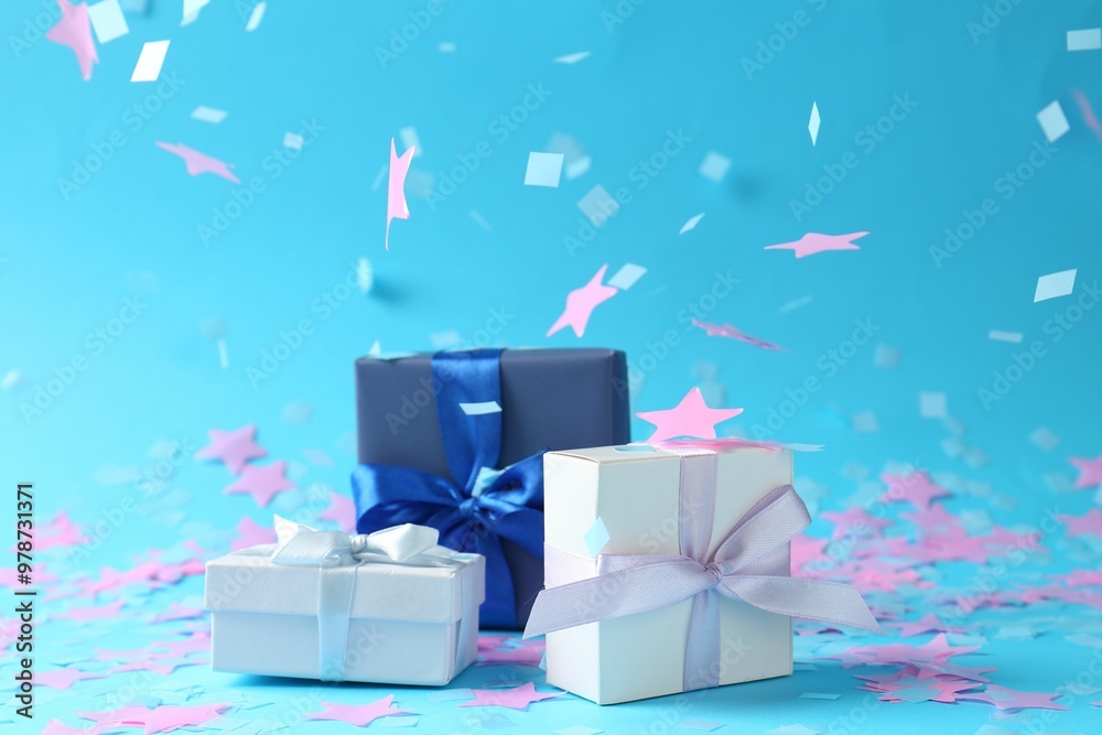 Canvas Prints beautiful confetti falling on gift boxes against light blue background