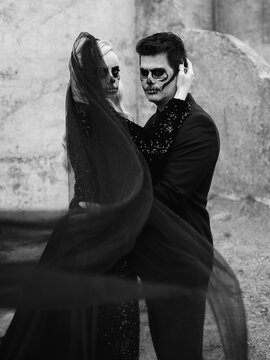 Spooky skeleton bride and groom embracing at Chambers Bay