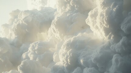 Naklejka premium Fluffy white clouds billowing softly under a bright blue sky at dawn