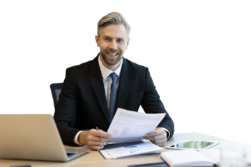 Mature businessman with beard working with documents, contracts and bills sitting at table using laptop at work on a transparent background