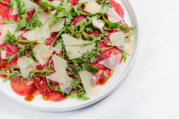 meat carpaccio with parmesan and arugula