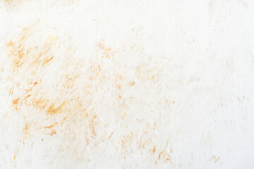 Dirty wall. Cat footprints or paw prints on white painted wall. Red soil stain on white wall texture background. Grunge and rough surface backdrop.