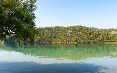 Calm Blue Lagoon on a Clear Summer Day – A Tropical Paradise for Relaxation