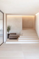 Modern minimalist interior with sleek stairs and cozy seating in a bright living space