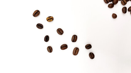 Natural roasted coffee beans on a white background.