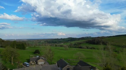 High Angle View of British Agricultural Farms at Countryside and Beautiful Landscape of Near Hills of Rotherham, England Great Britain of UK. April 30th, 2024