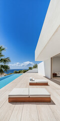 Fototapeta premium Serene outdoor space with lounge chairs beside a pool and ocean view on a sunny day in a modern architectural setting
