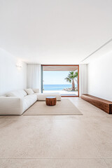 Fototapeta premium Spacious living room with ocean view and minimalist design in modern coastal home