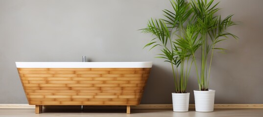 Elegant bamboo bathtub with indoor plants against a minimalist wall for a calming atmosphere