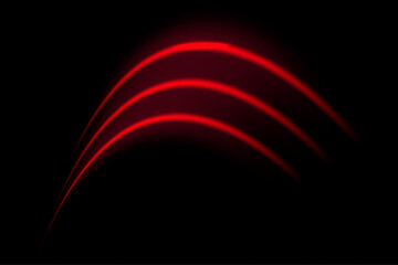 Red wave neon stripes or light flash arc. Laser beams, horizontal beams. Beautiful light reflections. Glowing stripes on a black background.