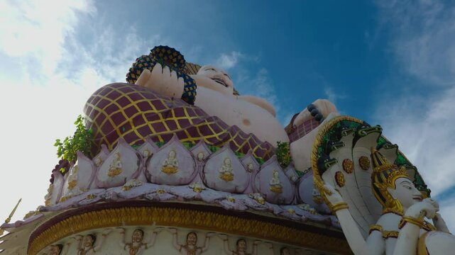 Budai from low angle looking up, Vishnu sitting in front