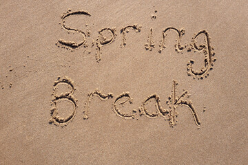 Spring break inscription in the sand