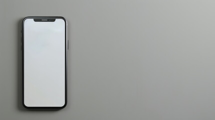 Modern smartphone with blank screen on a gray background.