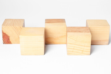Many blank wooden cubes on white background