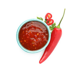 Hot chili sauce in bowl, parsley and pepper isolated on white, top view
