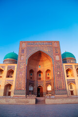 The ancient Mir-i-Arab madrasah at sunset.