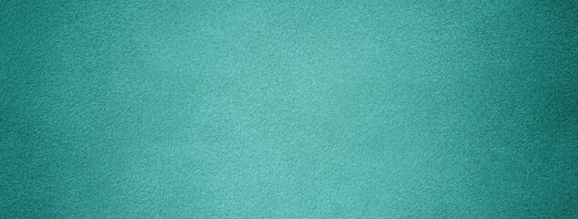 Cyan background from felt textile material with vignette. Structure turquoise suede velvet fabric...