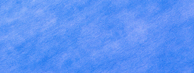 Texture of blue felt background with spots of fabric, macro. Structure of sky woolen textile with...
