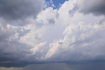 Obraz premium Blue sky and white and gray clouds. Texture background for design.