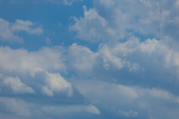 Blue sky and white and gray clouds. Texture background for design.