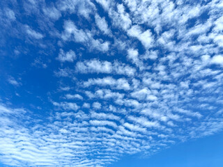 The sky is clear and bright, and the clouds are scattered throughout the sky.