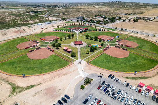 Aerial view of softball fields and recreational areas surrounded by green spaces and trees, Carlsbad, New Mexico, United States.