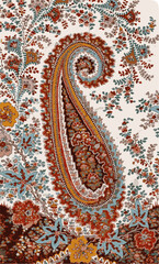 A close-up of vibrant paisley patterned fabric, showcasing intricate floral motifs and the iconic teardrop shape against a delicate floral background.