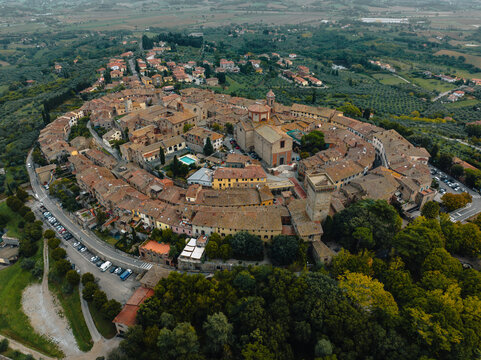 Aerial view of the historic medieval town with beautiful stone buildings and charming streets, Lucignano, Italy.